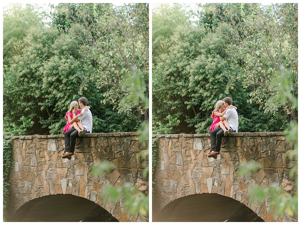 Couple cuddling and kissing on stone bridge