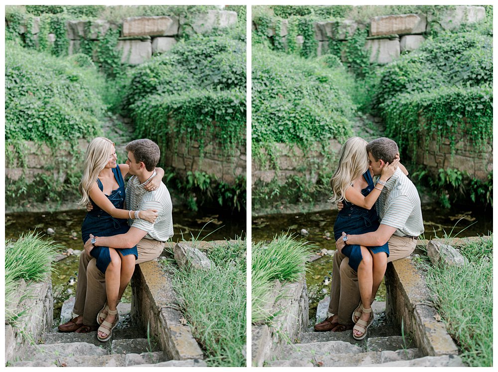 Girl sitting on guys lap in front of pond