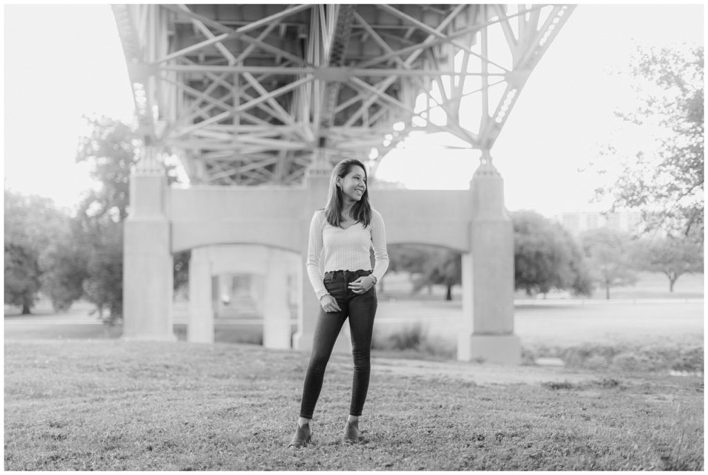 BW Girl standing under bridge