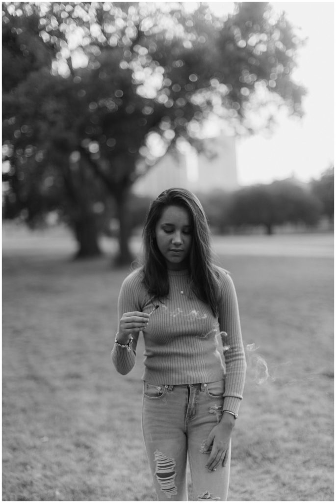 BW Girl holding smoking sage bundle