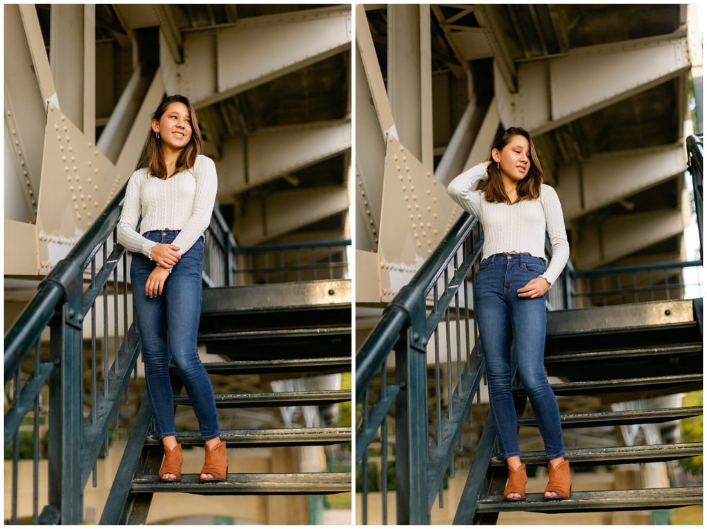 Girl standing on steps under bridge