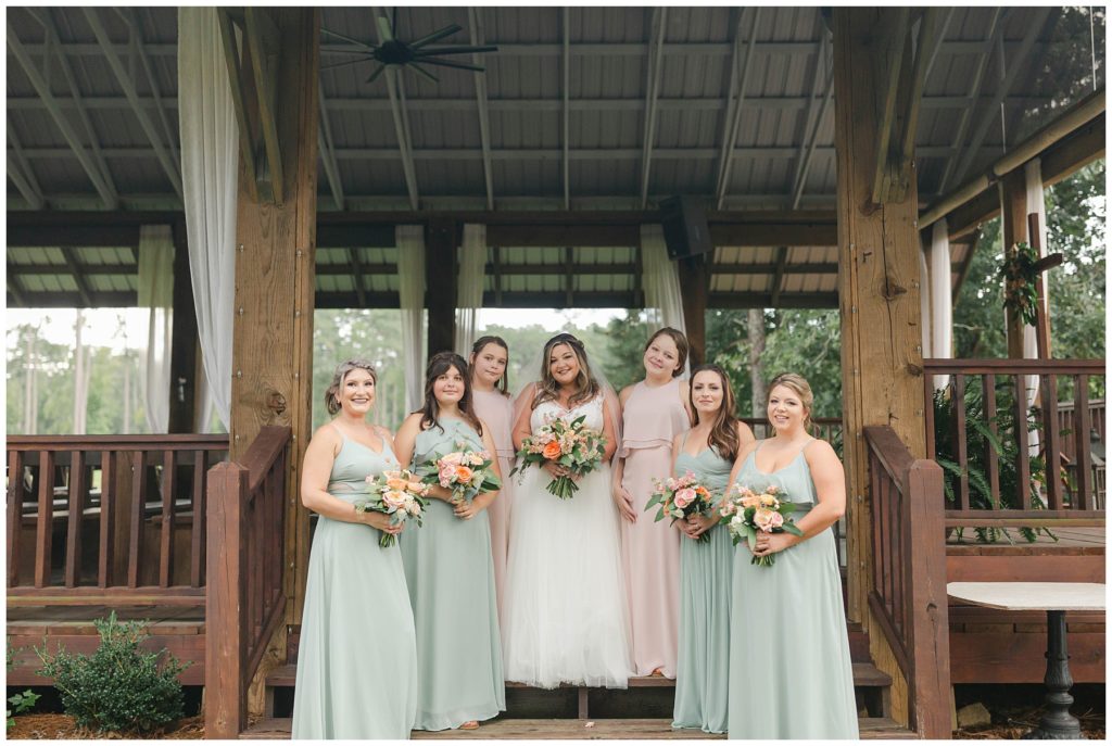 Bride and bridesmaids standing in chapel at Pine Knoll Farms
