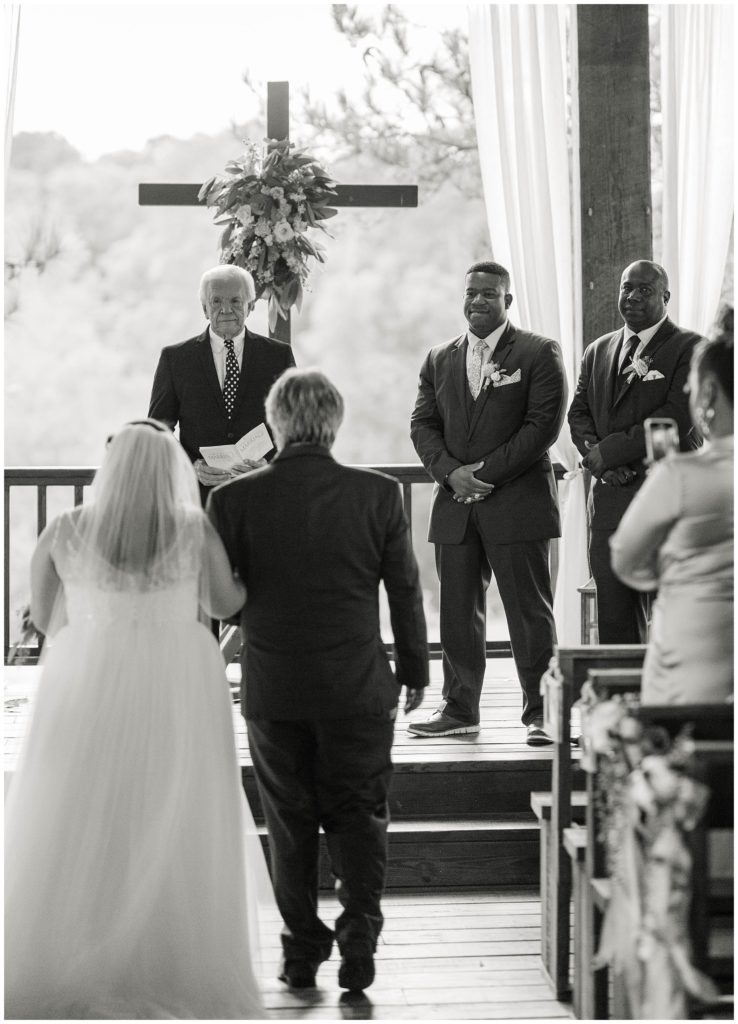 BW bride walking down aisle with father