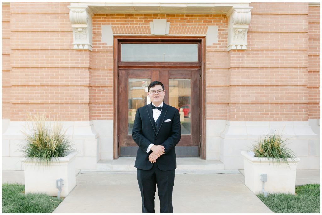 Groom standing outside