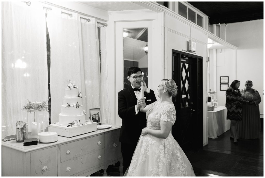 Bride and groom cake cutting at Hugos on the Square