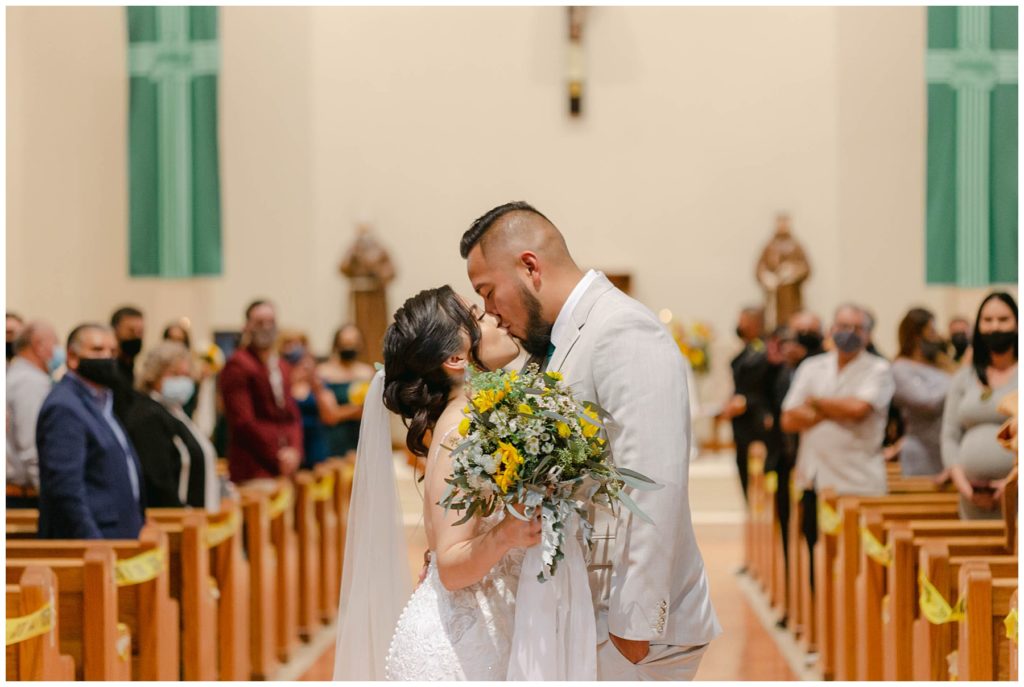 Bride and groom kiss