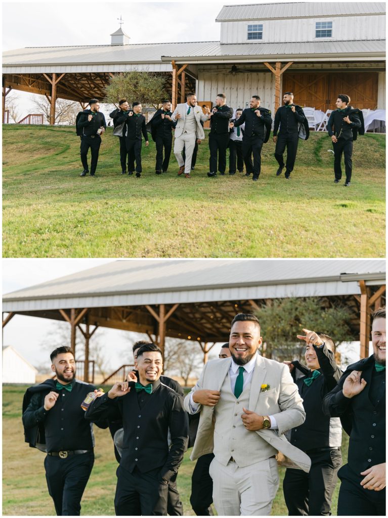 Groom and groomsmen walking in big white barn wedding