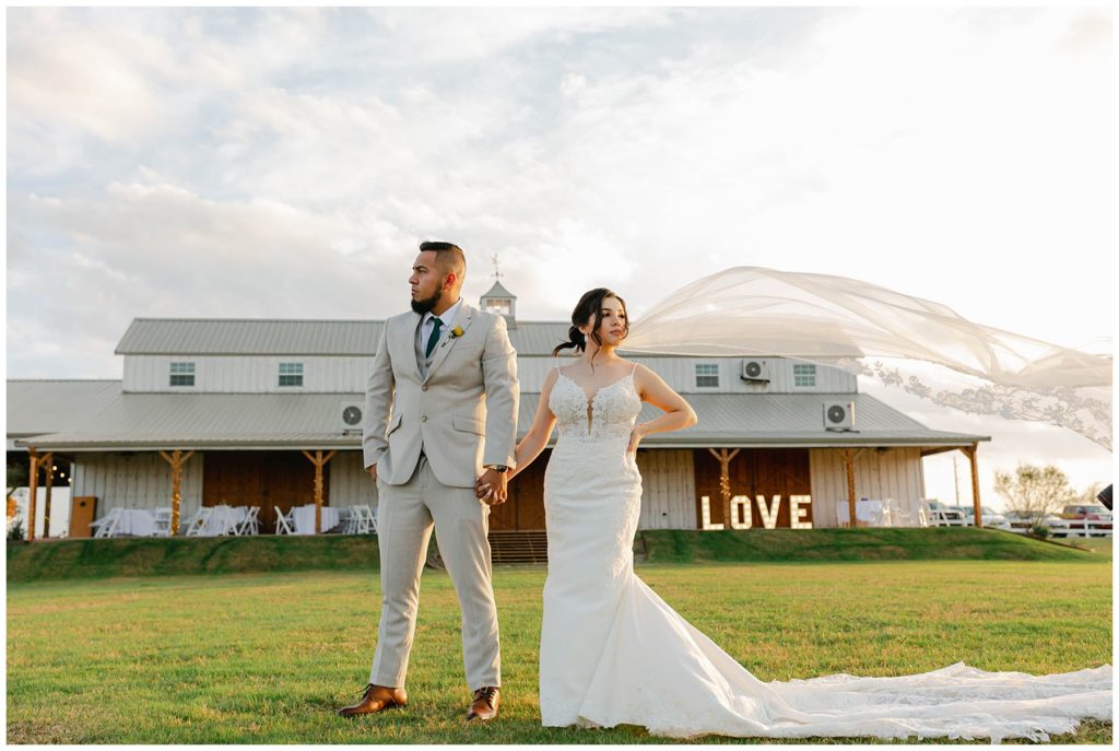 Bride and groom standing at Big White Barn wedding 