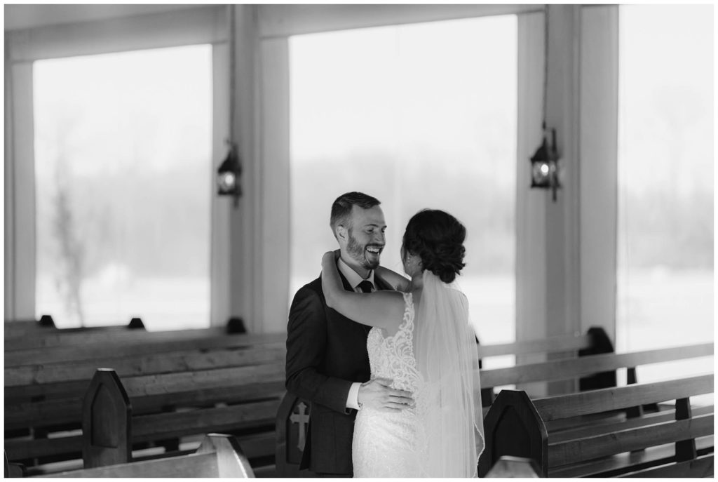 bw bride & groom kiss after first look at The Brooks at Weatherford wedding chapel