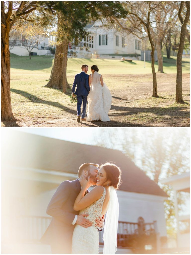 Bride and groom walking through trees in sunlight