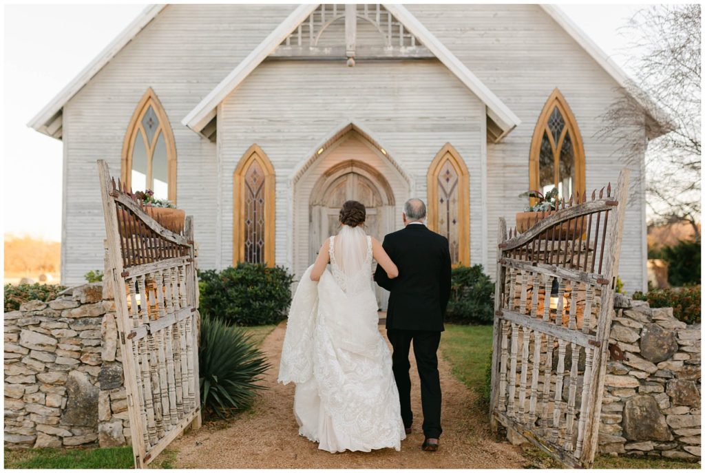 bride and father of the bride walking into The Brooks at Weatherford wedding chapel