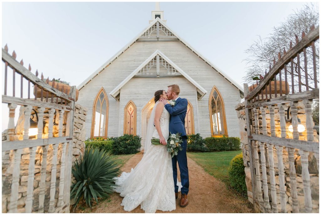 bride and groom kiss at the brooks at Weatherford chapel