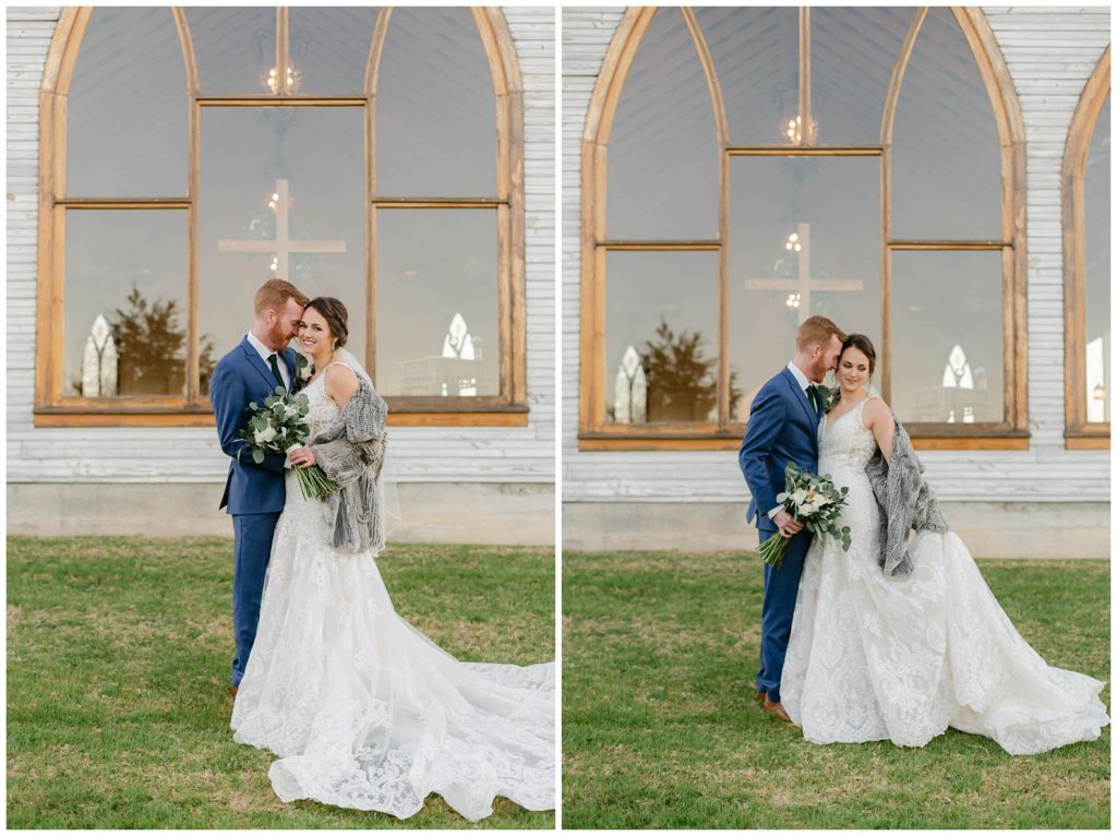 bride and groom embracing in front of chapel