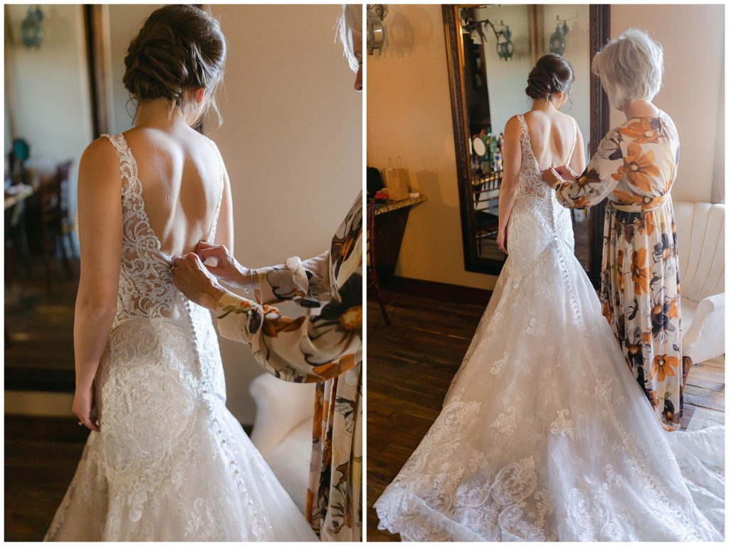 mother of bride buttoning bride into low back wedding gown
