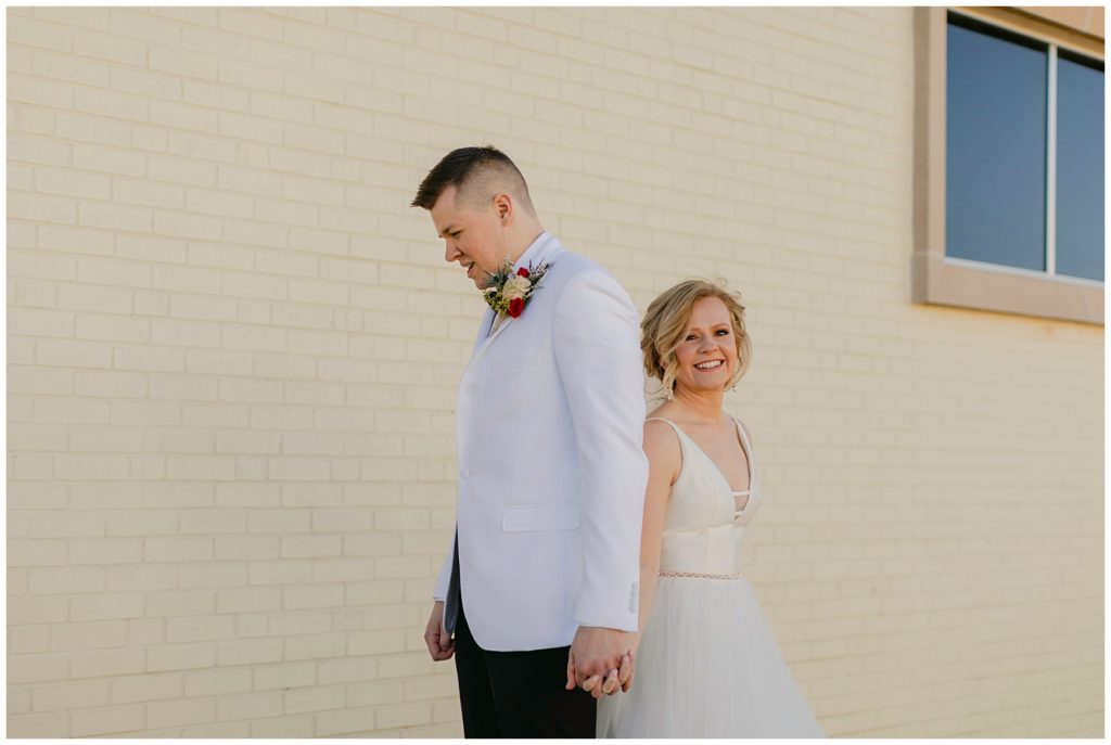 bride and groom back to back