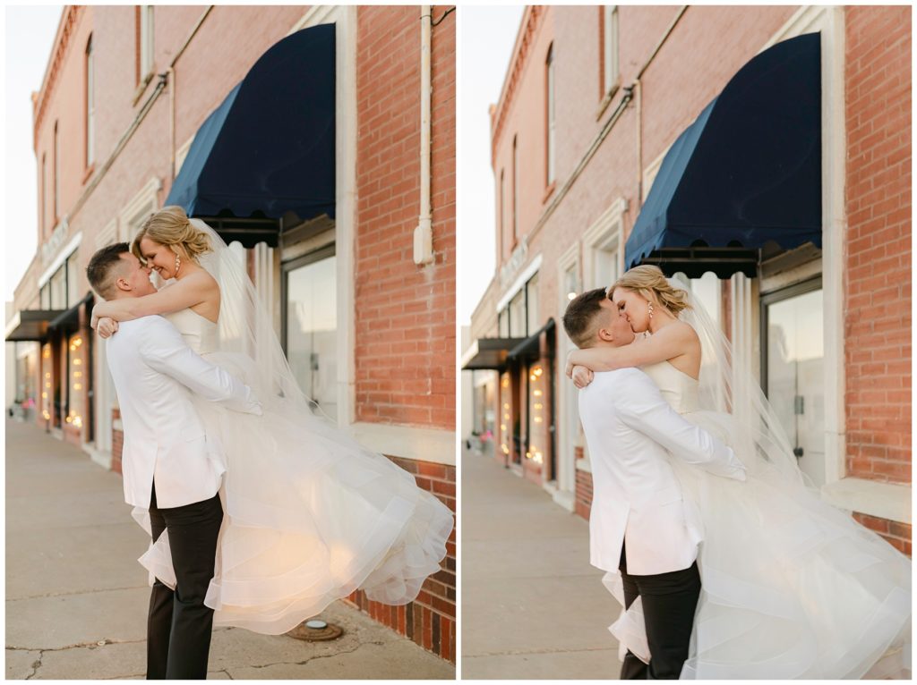 Groom lifting bride up to kiss her