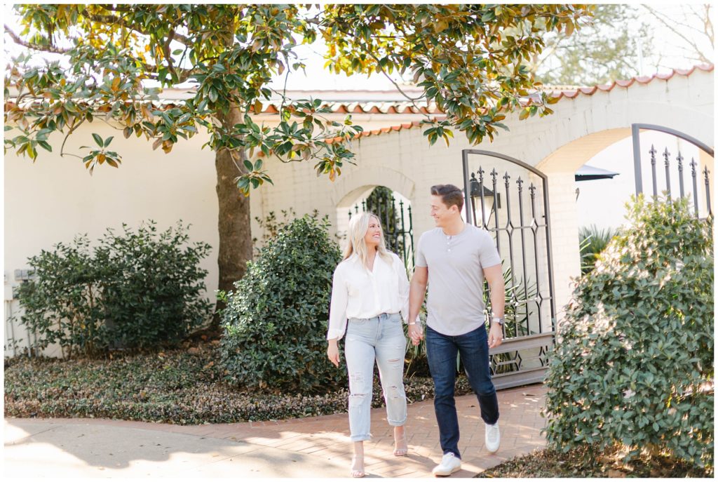 Guy and girl walking hand in hand- Dallas Arboretum