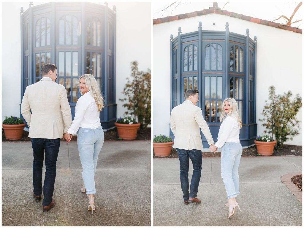 Girl looking over shoulder while holding hands with fiancé