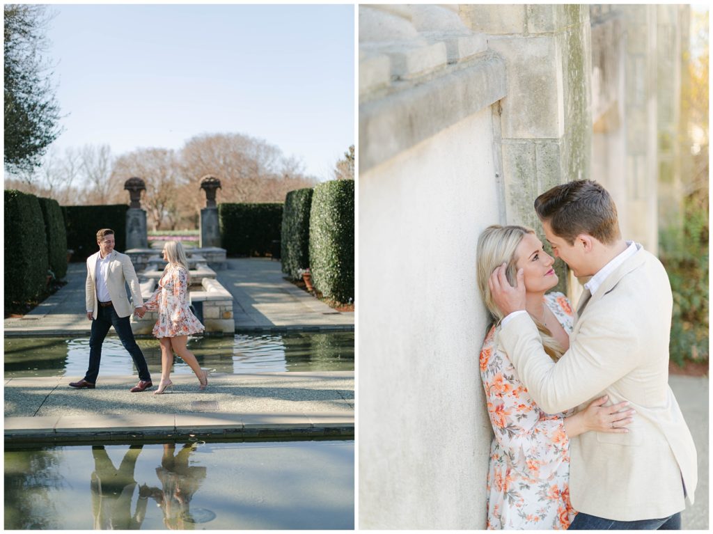 engaged couple walking and kissing against wall