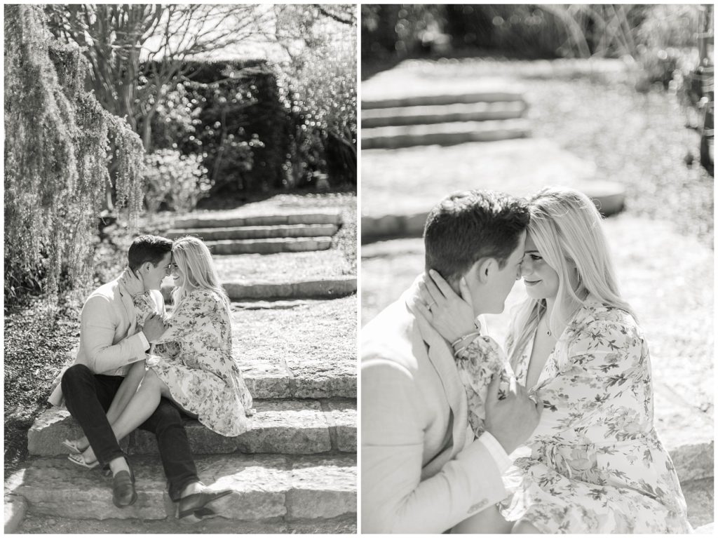 BW couple cuddling on steps