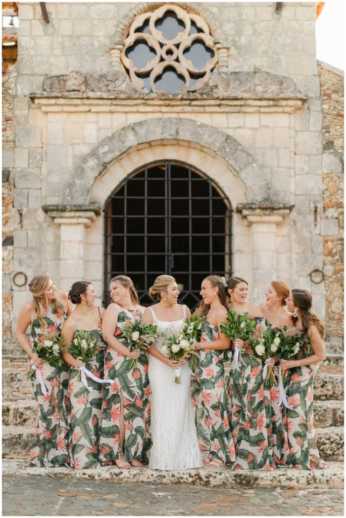 Bride laughing with bridesmaids in Dominican Republic wedding
