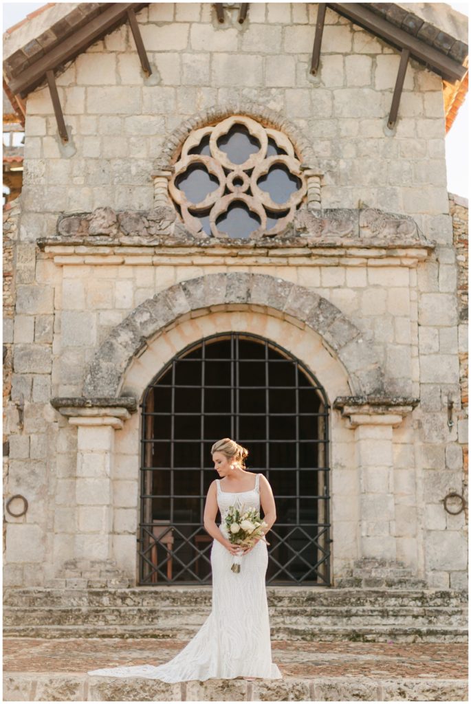 Bride posing in front of St. Stanislaus Church Dominican Republic wedding