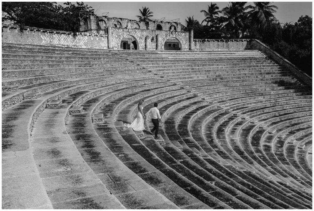 Bride and groom walking down steps at The Amphitheater at Atlos De Chavon Dominican Republic Wedding