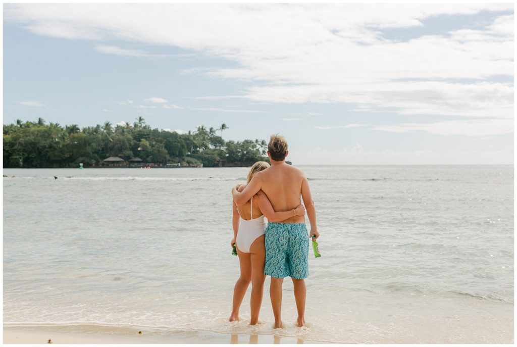 Newly weds hugging on beach in Dominican Republic Wedding