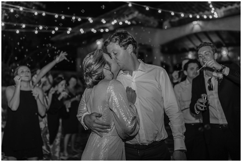 BW bride and groom kissing at Dominican Republic wedding exit