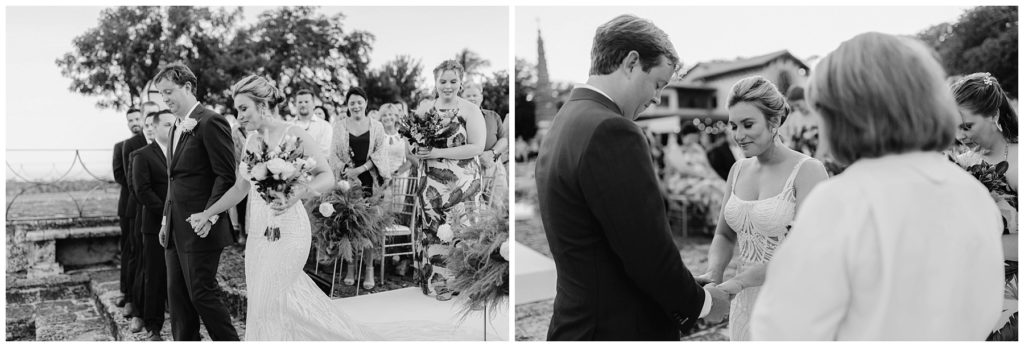 bride and groom holding hands at alter