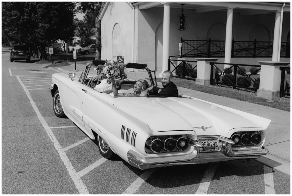 bride and groom in wedding getaway car South Carolina Catholic wedding