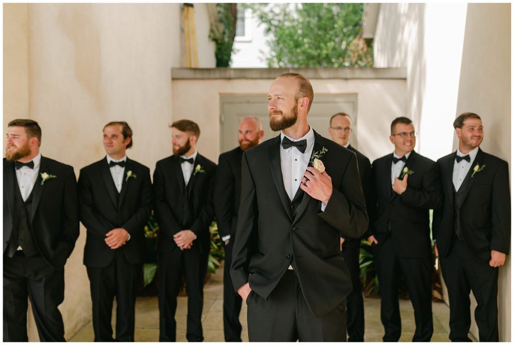 groom standing with groomsmen in South Carolina Catholic wedding
