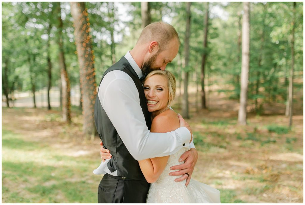 bride and groom hugging