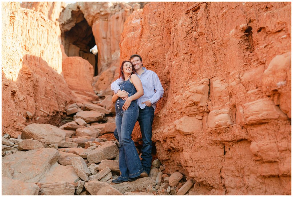 Guy with arm wrapped around girl Palo Doro Canyon Texas engagement