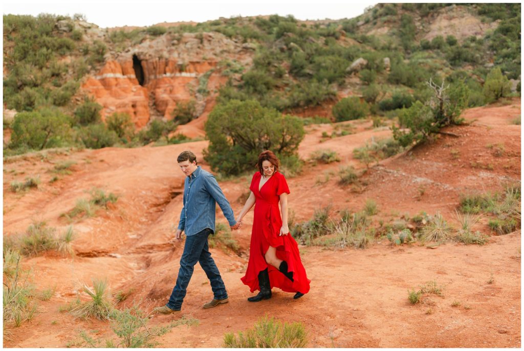 Couple walking hand in hand Palo Duro Canyon Texas engagement