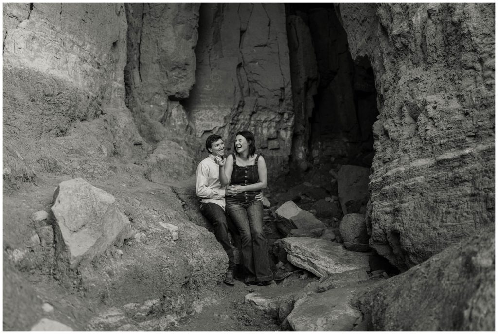 couple playing in canyon caves Texas engagement
