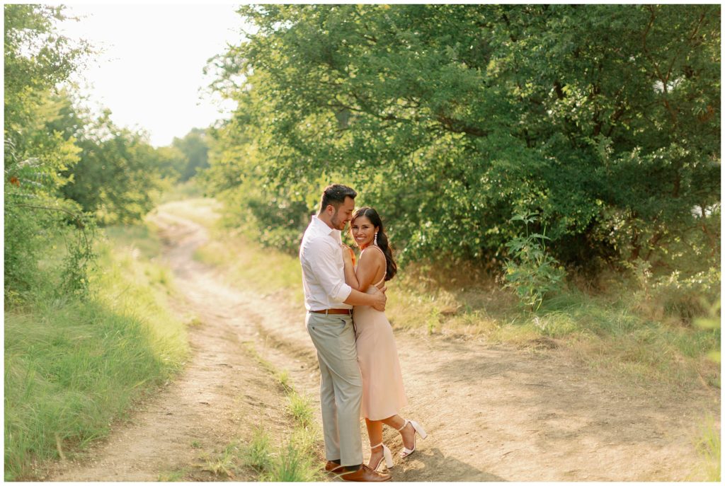 couple standing on dirt path