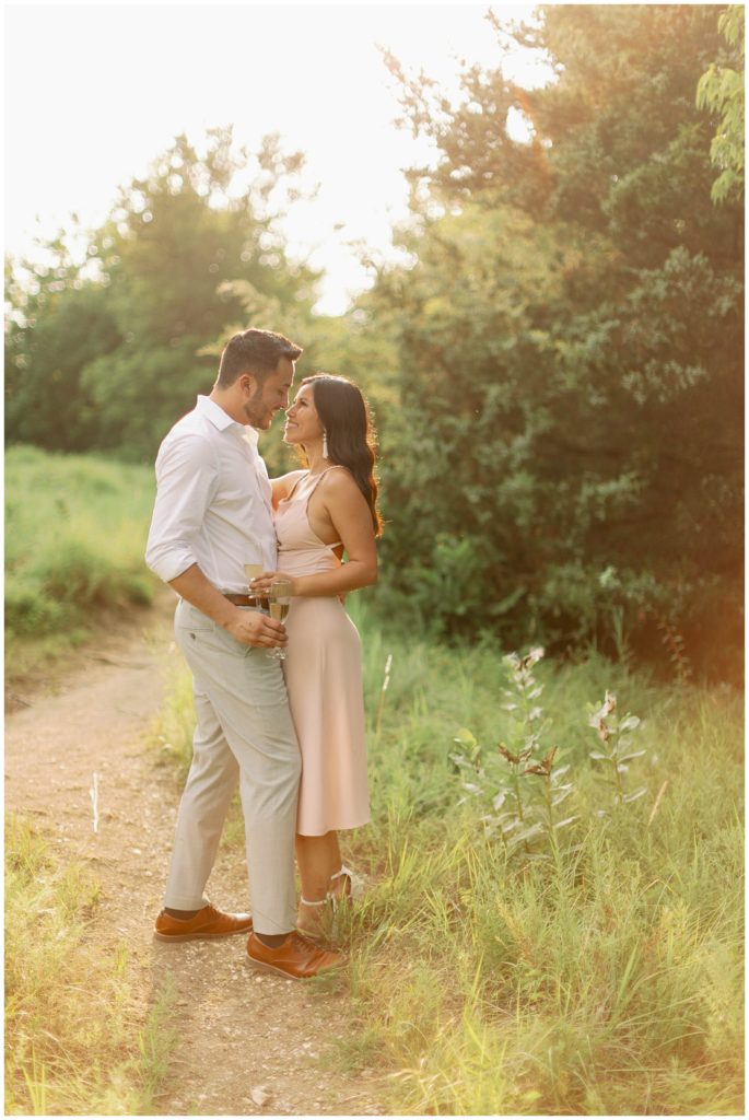 Couple hugging and toasting champagne