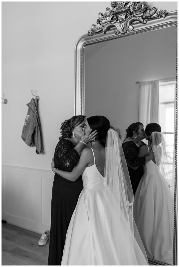 BW bride embracing mother at The Orchard Texas wedding