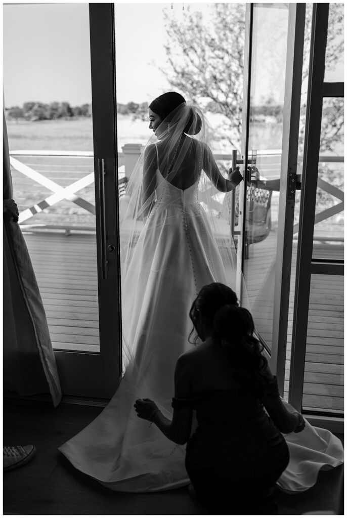 BW bride standing in doorway at The Orchard Texas wedding venue