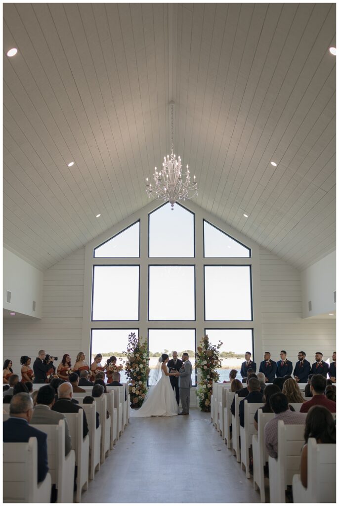 bride and groom exchanging vows The Orchard Texas wedding venue