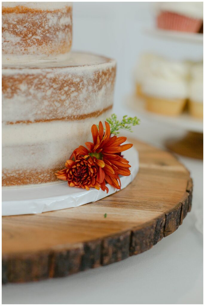tiered shaved wedding cake with flower