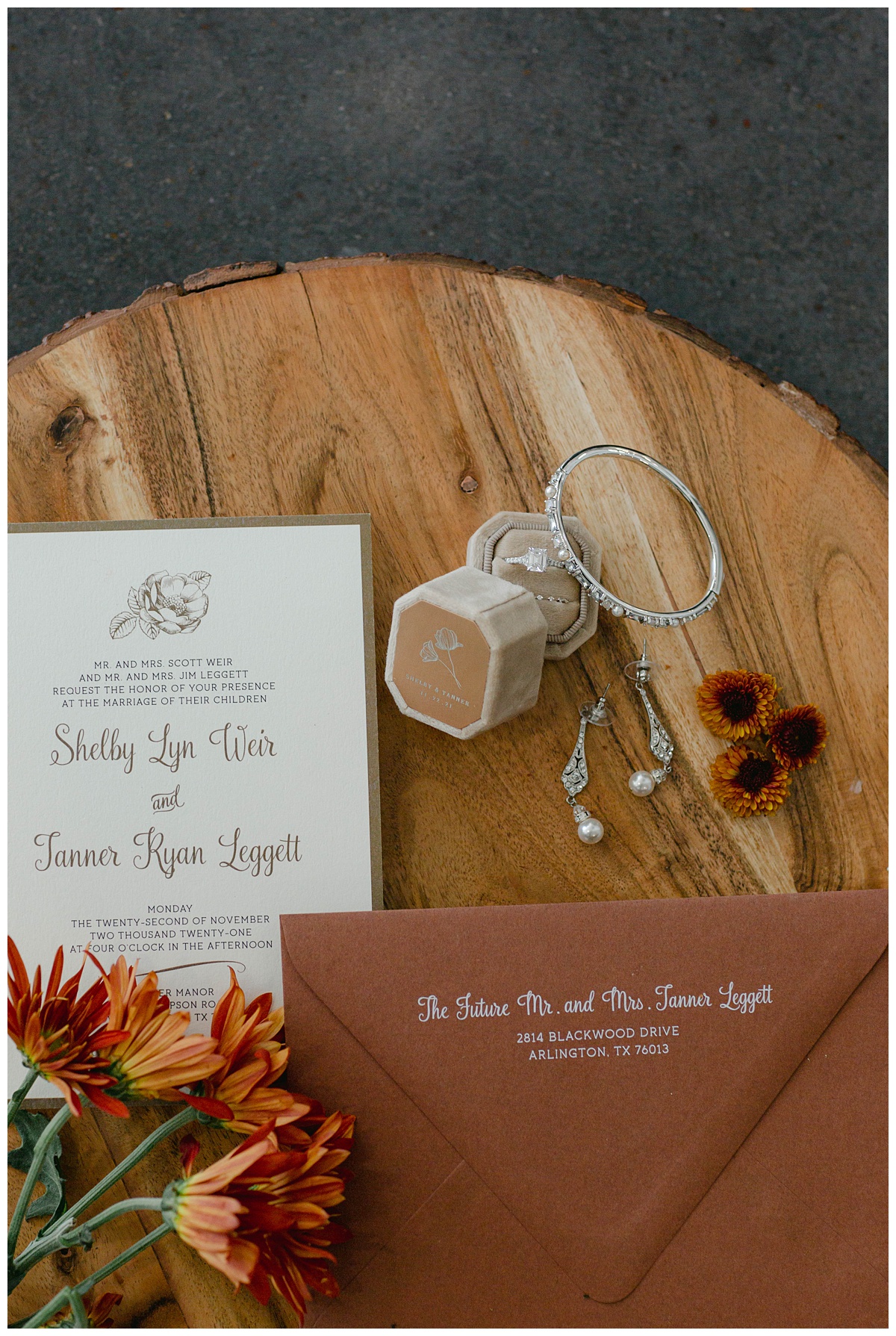 diamond & pearl wedding jewelry with wedding invitation at The Springs in Weatherford