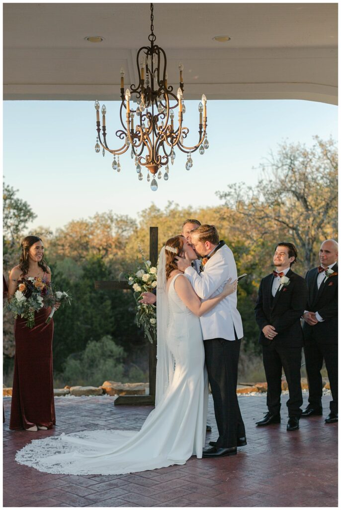 bride and groom kiss at The Springs in Weatherford Texas wedding
