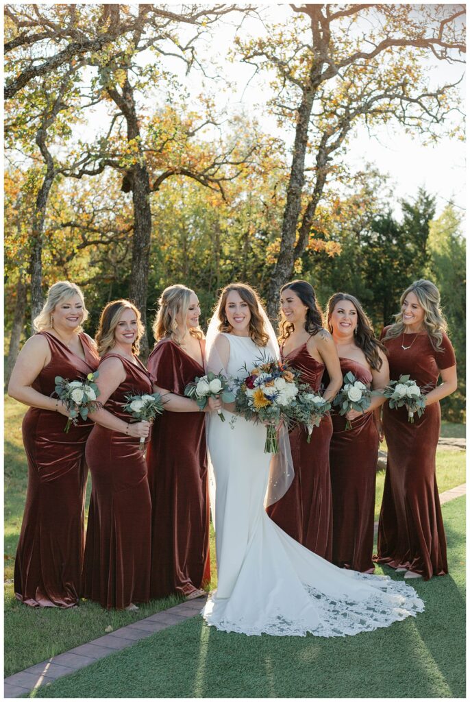 bride standing with bridesmaids