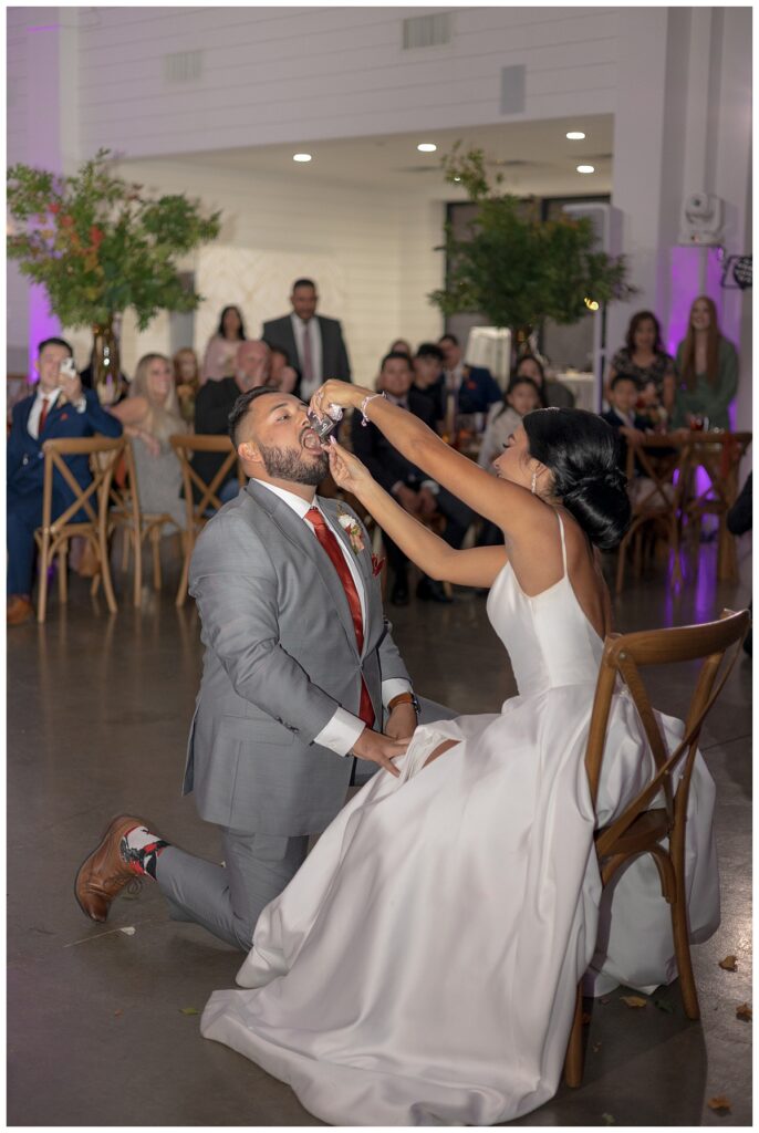 bride giving groom shot