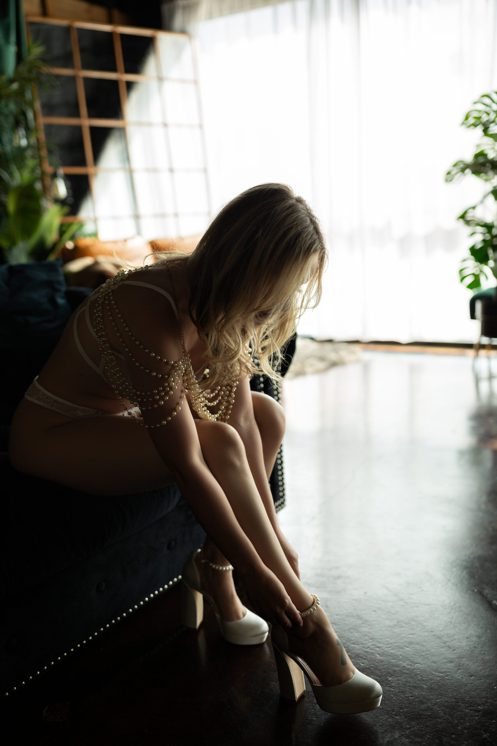 a woman in a boudoir studio